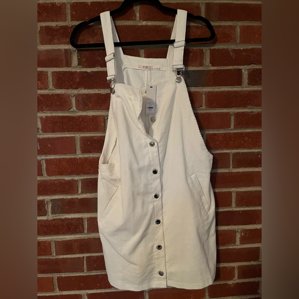 Super cute white corduroy overall button down dress